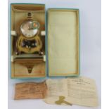 A German Schatz Barock 400 day plastic cased clock and wall bracket c1950s in original box with