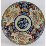 A large 19th century Japanese porcelain Imari charger with hand decorated border of birds.