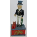 A cast iron Uncle Sam mechanical money box. Height 29cm. Condition report: No issues.