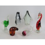 Four Murano glass animals of varying types and colours, two labelled, and two similar Wedgwood anim