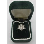 An 18ct white gold diamond cluster ring comprising of seven brilliant cut diamonds. Approx 1.5cts,