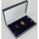 A 9ct gold pendant set with 22 yellow sapphires, a pair of 9ct white gold yellow sapphire &