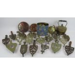 A collection of antique cast iron and brass flat iron trivets plus a quantity of horse brasses and