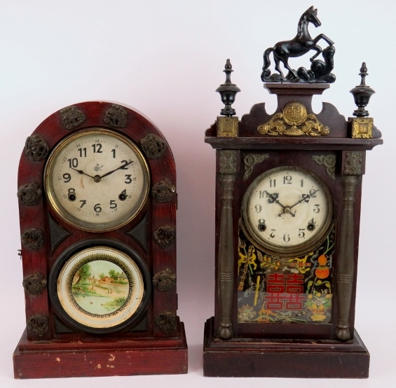 Two early 20th century Japanese striking mantel clocks both with decorated glass panels. One