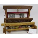 A vintage wooden table top weaving loom, 43cm x 34cm. Condition report: Sold as seen.
