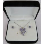 A tanzanite & white sapphire cluster pendant on a silver chain and a pair of 9ct white gold