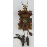 A vintage West German Black Forest style cuckoo clock with striking movement, c1980s. Height 35cm.
