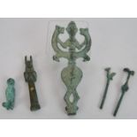 Five cast bronze items of antiquity, origin unknown, two appear to be cloak pins and one a Shabti.