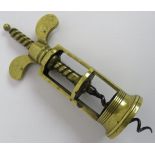 An antique Farrow & Jackson brass corkscrew, length 16cm. Condition report: No issues.