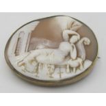 A yellow metal cameo brooch/pendant of a reclining maiden, thought to be Cleopatra, approx 35mm x