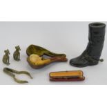 An Edwardian carved Meerschaum pipe and case, a cigarette holder and case, a pair of brass hounds, a