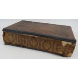 An 1816/18 Holy Bible by Caxton Press containing engravings by Nuttall Fisher & Co, leather bound.