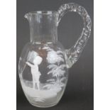 A 19th century Mary Gregory style glass jug with hand decorated body depicting a young boy,