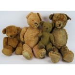 Two large vintage teddy bears both jointed and with growls, a small 1970s teddy bear and a modern