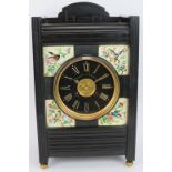 A Victorian slate striking mantle clock in the aesthetic movement taste with hand painted