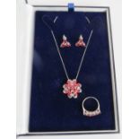 A matching set of Tanzanian ruby & diamond jewellery. Comprising of a 9ct white gold pendant set