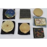 Six vintage powder compacts including four Stratton, one unbranded and an Olive Musical compact. (