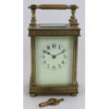 A good quality 8 day striking carriage clock in classical style brass case. Key present. Height 18.