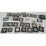 A collection of crown coins including some silver, earliest 1819, plus an 1887 US silver dollar.