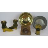 A pair of 19th century brass boots, a brass spill holder, a brass offertory plate, an 18th century