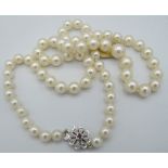 A good quality strand of individually knotted graduated pearls, ranging from 5.8mm to 9.9mm. The 9ct