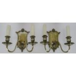 A pair of mid 20th century silver plated two arm wall sconces with Italianate shield style plates.