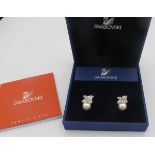 A pair of Swarovski & simulated pearl earrings in a flower design, original box. Condition report: