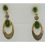 Russian diopside drop earrings, bezel set stones, post back, gold/925. Condition report: Excellent