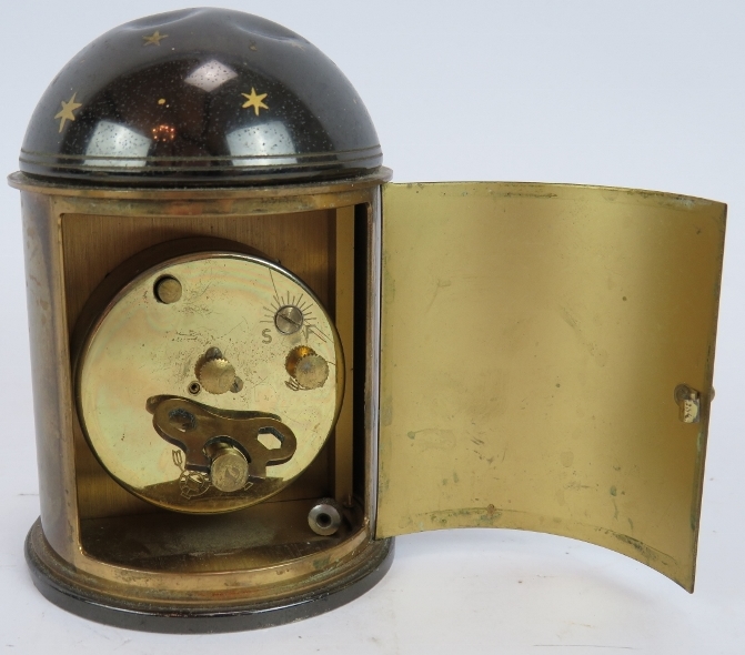 A brass cased orb quartz clock, a similar clock on stand and a German Europa alarm clock in a - Image 5 of 6