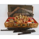 An inlaid wooden box containing a large Nativity set of moulded figures and a kit form wooden