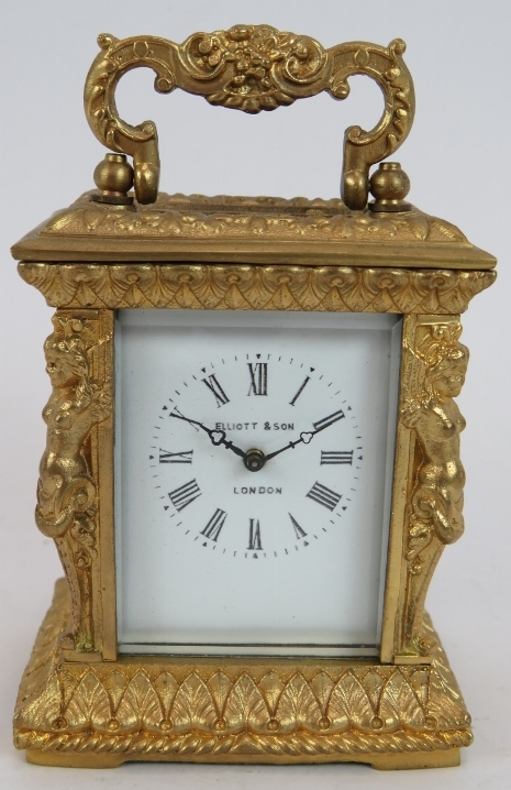 A small gilt brass 8 day French carriage clock in Empire Revival style by Elliott & Son, London.