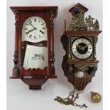 Two contemporary antique style wall clocks, one with ornate brass mounts, the other seemingly