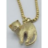 A heavy 9ct yellow gold box chain necklace with an unmarked yellow metal cat pendant. Approx