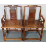 A pair of Chinese Juzhou style jumu wood (southern elm) open sided armchairs with carved back panel