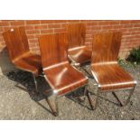 A set of four contemporary cantilever dining chairs in the manner of Alver Aalto, the walnut plywood