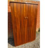 A mid-century tropical hardwood double wardrobe of small proportions by Morris of Glasgow, with push