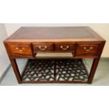 A Chinese Period style tropical hardwood desk, housing four short drawers with brass