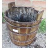 An antique fruitwood coopered bucket. Condition report: Heavy patination H38cm Diameter 32cm (