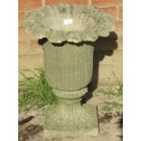 A nicely weathered reconstituted stone garden planter of tulip form in the Neo Classical taste.