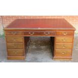 A substantial Victorian mahogany twin pedestal partners desk, with inset gilt tooled burgundy