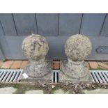 A pair of nicely weathered reconstituted stone ball finials. Condition report: No issues. H30cm (