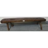 A small antique elm bench seat in rustic naturalistic form. Condition report: Various marks