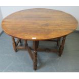 An 18th century fruitwood oval gateleg table of excellent colour, on turned supports. Condition