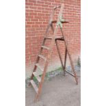 A vintage oak folding A-frame stepladder. Condition report: Various marks and paint spots. H207cm