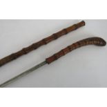 A late 19th century bamboo sword stick with bamboo root handle, cord bound decoration and grooved