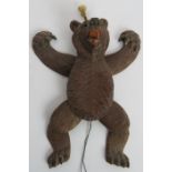 A late 19th century well carved Black Forest dancing bear toy with glass eyes and hand painted