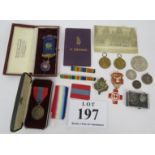 A collection of military and civic medals including two WWI victory medals, an Imperial Service