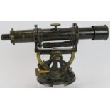 A vintage brass Military Theodolite stamped H O 31 with broad arrow. Length 34cm. Height 19cm.