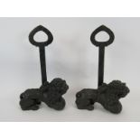 Two antique cast iron lion door stops, door porters with wrought iron handles, probably 18th