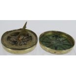 An early 19th century brass pocket folding sundial and compass in screw topped brass case. No